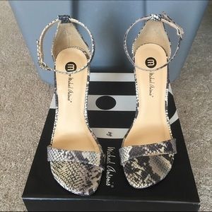 Snake printed sandals.
